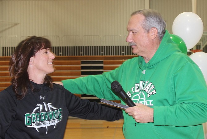 Mayor Ken Tedford, right, has supported youth and Greenwave sports for decades. Here, he congratulates former Greenwave girls basketball coach Anne Smith for winning a state championship.