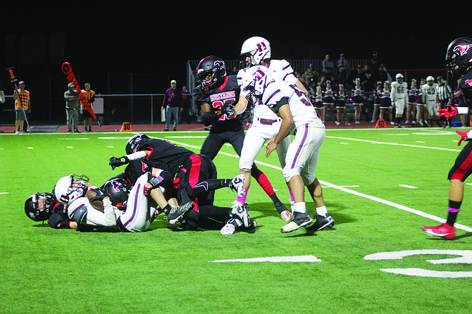 The Mustangs get ready to sack the Dayton QB.