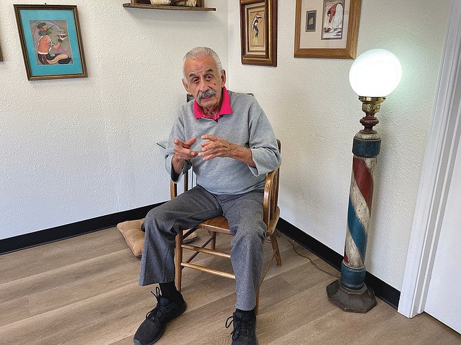 Scott Neuffer placed first in the enterprise feature story category for his coverage of Ricardo Romero (pictured) celebrating 60 years as a Carson City barber.