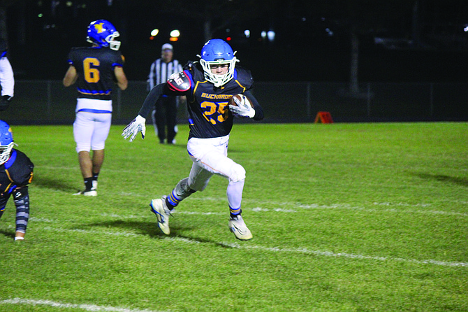 Lowry's Donovan Walker looks for room to run in the Buckaroos' 38-20 win over South Tahoe on Friday night in Winnemucca.