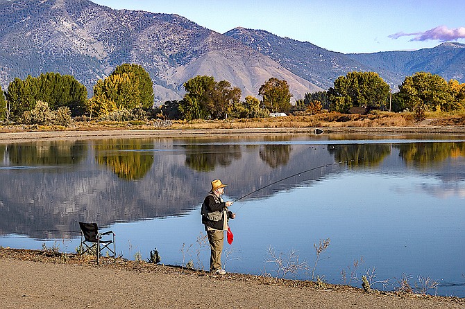 Donald O'Connor fly-fishes at Mountain View Pond in Gardnerville on Oct 10. Minden photographer Jay Aldrich had his own 'one that got away' story. 'Just after I put my camera away, he caught and released a trout,' Aldrich said.