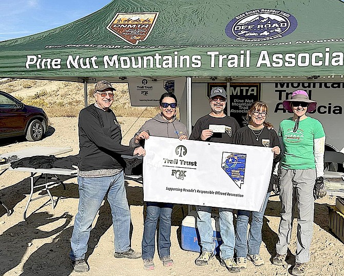 Pine Nut Mountains Trails Association celebrates a $1,000 grant from the nonprofit Nevada Offroad Association. Photo by Alexis Nelson