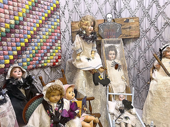 The Douglas County Historical Society's doll collection greets visitors to the Carson Valley Museum & Cultural Center in this Halloween display.