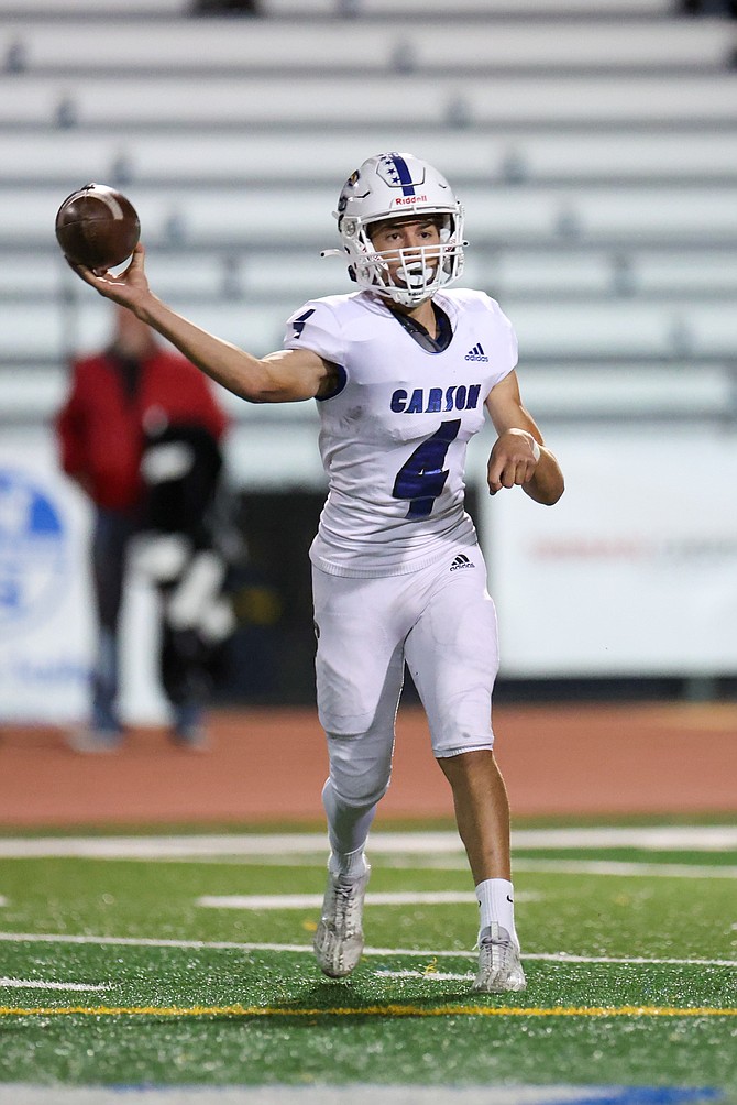 Carson quarterback Drake Hardcastle turns to throw a screen pass against North Valleys two weeks ago. Carson and North Valleys will meet to open the Class 5A Division III postseason Thursday at 7:30 p.m.
