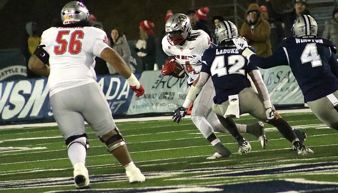 Wolf Pack linebacker Jackson LaDuke closes in on a New Mexico runner during Nevada’s win on Saturday night.