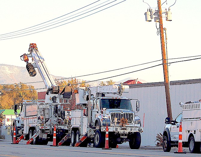 NV Energy workers replace a power pole along Highway 395 south of Gardnerville on Oct. 26.