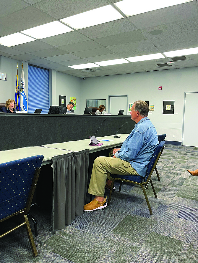 Timothy Puliz, seated, was appointed to the Airport Authority by the Carson City Board of Supervisors on Thursday.