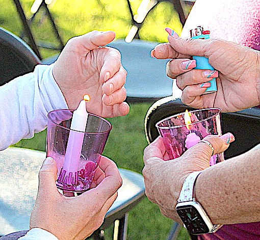 Attendees lit candles in early October to cast a light on domestic violence in Douglas County.