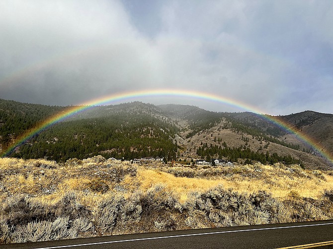 A rainbow arcs above Eagle Ridge north of Genoa on Monday morning.