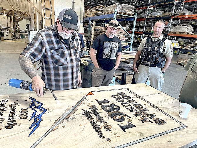 Work on the woodworking and metalworking portions of a custom table for the Carson Valley Museum & Cultural Center was led by local artists Tahoe Reclaimed and Reclaimed NV.