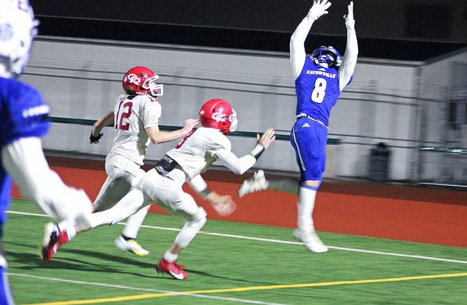 Eatonville's Ky Nation goes up high to catch a pass for the Cruisers' final touchdown against Castle Rock.
