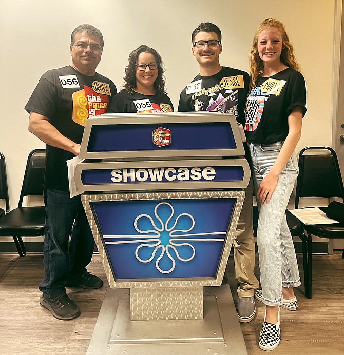 Carson City resident Molly Otto, right, stands with her future in-laws, far left, Javier Lopez and Marie Lopez, and fiancée Jesse Lopez, behind the showcase of the game “The Price is Right.”