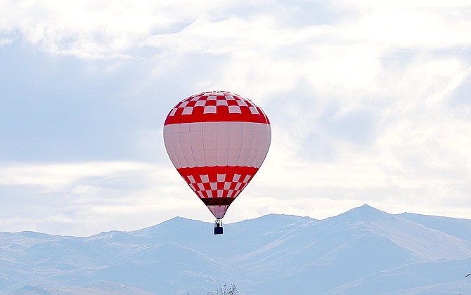 One of three balloons floats to a landing in Gardnerville on Friday morning.