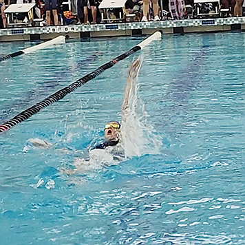 Nevaeh Serna swims the backstroke at the Nevada State Short Course Championships in Henderson.