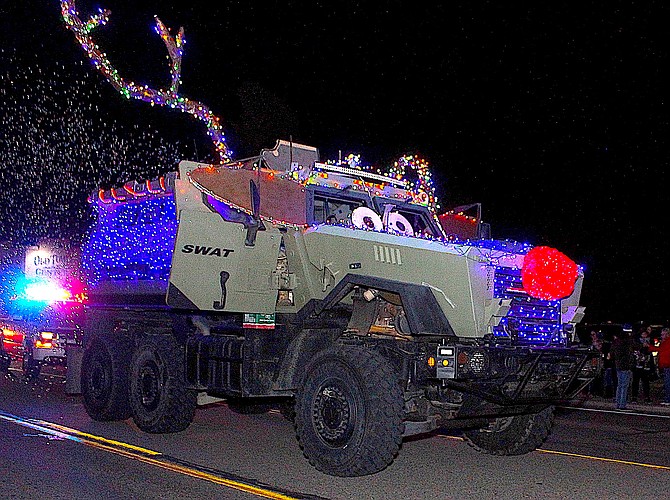 Rudolph the red-nosed MRAP leaves a trail of bubbles during the 2021 Parade of Lights through Gardnerville as part of the Douglas County Sheriff’s Office entry.