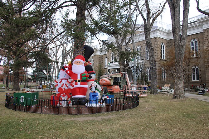 An empty lift sits amid holiday decorations in front of the Nevada Capitol in downtown Carson City on Nov. 30, 2023.