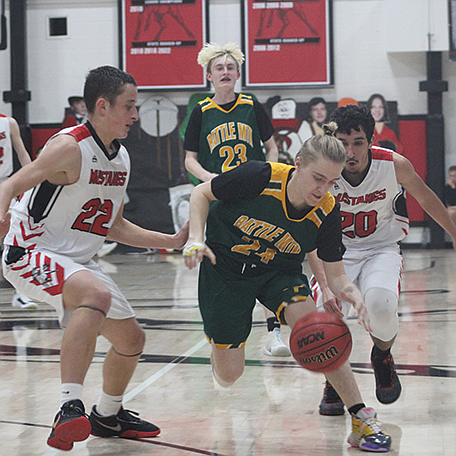 Taylor Montes (24) and Luis Sanchez (20) compete against Battle Mountain at zone last season.