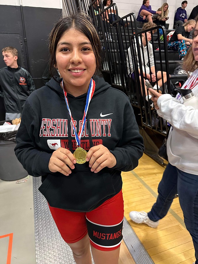 MIKE BROOKS • Provided to Great Basin Sun
Freshman wrestler Magdalena Ramirez displays her first-place medal from the Douglas Tiger JV tournament.