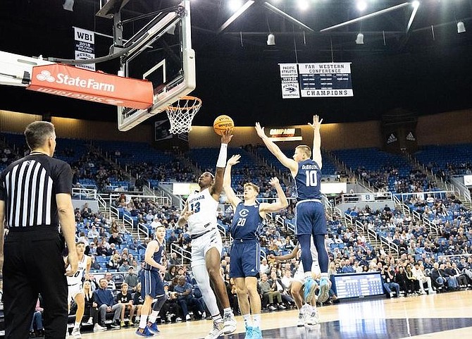 Kenan Blackshear drives to the hoop Wednesday against UC Davis at Lawlor Events Center.