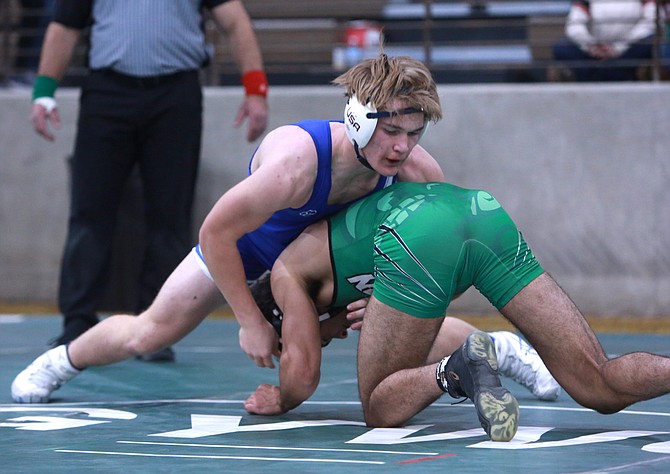 Carson High junior wrestler JT Heaton works atop his opponent at the Earl Wilkins Invitational in Fallon last weekend.