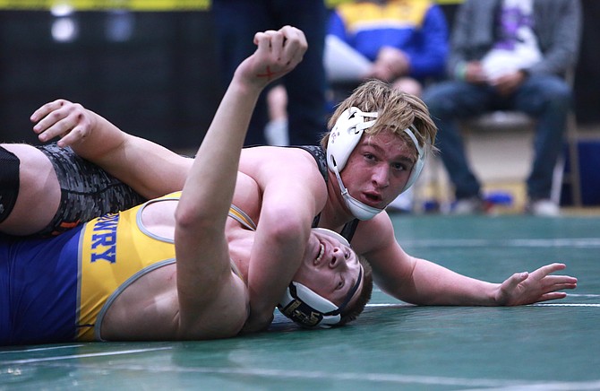Douglas High senior Sage Adie looks for a pin at the Earl Wilkins Invitational in Fallon this past weekend.