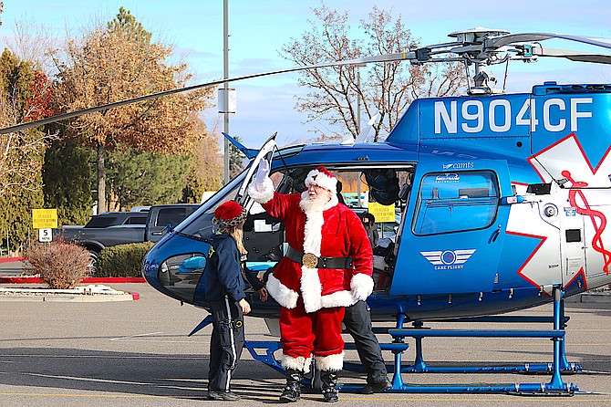 Santa hitches a ride to Minden on CareFlight landing at the Carson Valley Inn on Friday.