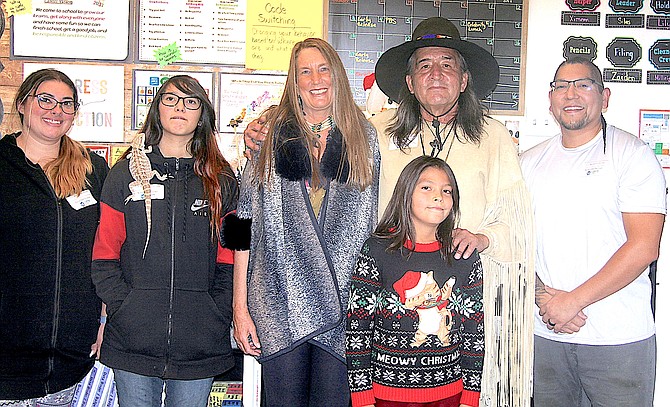 Nine-year-old Silas Jim’s family gave a presentation to his classmates Wednesday to help educate them on Wa-she-shu culture. Pictured are Brittney Jim, Tira Jim, Dennis Sheehan, Art George, Silas and Jordan Jim.