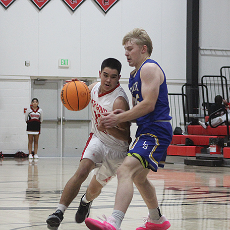 Ayden Montes (22) plays offense against Lowry.