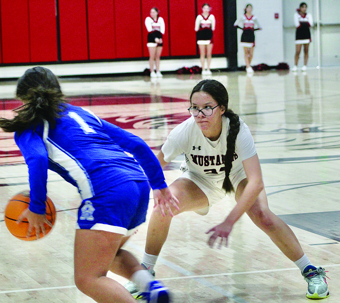 Pershing County's  Anna Happy guards against Carson on Saturday at PCHS.