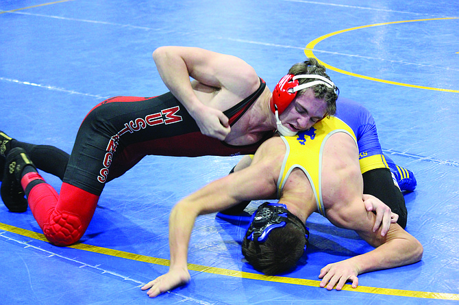 Pershing County’s Jeffery Elerick control’s his 138-pound match against Lowry’s Bradyn Snyder at the Cody Louk Invitational in Winnemucca.