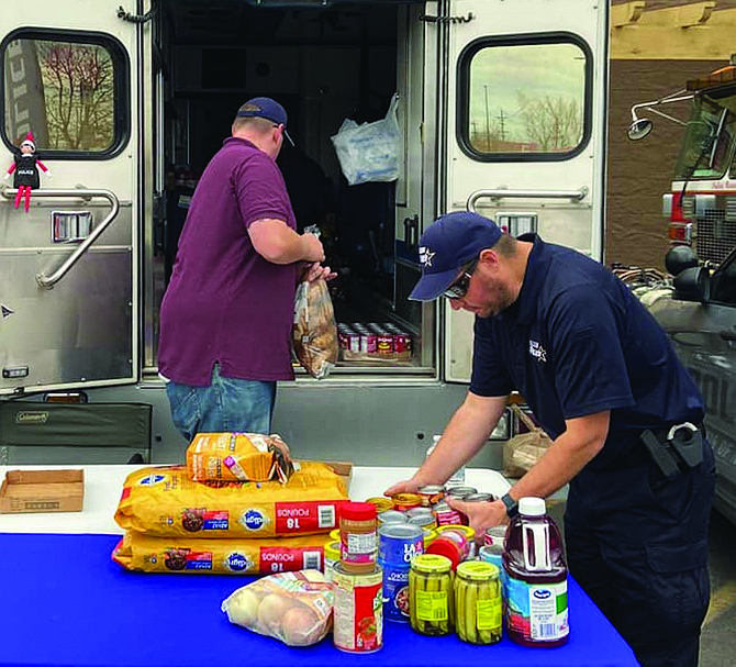 Fallon Police personnel who gathered food included Sgt. Chis Bloomfield and Sgt. Josh Schumann, right.