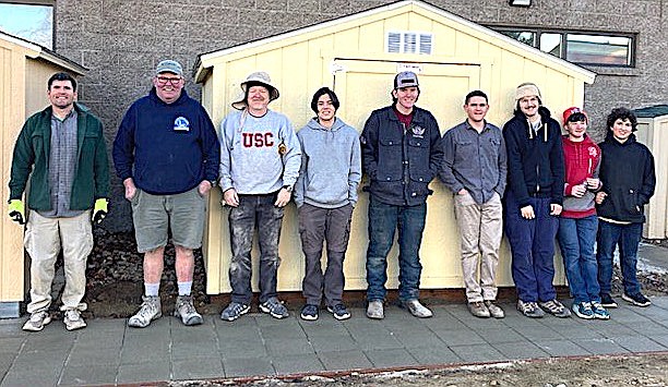 Scouts and their helpers built a shed behind the Minden Branch of the Douglas County Public Library.