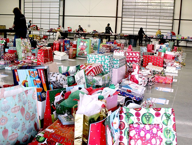 Gifts are ready n Thursday for distribution at the Douglas County Fairgrounds for Project Santa Claus today and Saturday.