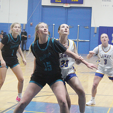 Lowry’s Maura Braatz battles for a rebound during the Lady Bucks’ 63-36 win over North Valleys on Saturday afternoon in Winnemucca.