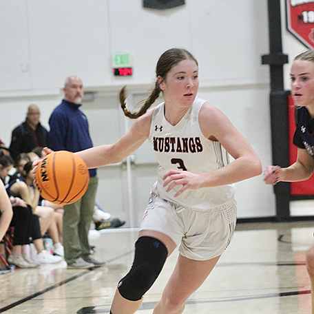 Raegan Burrows gets past Sierra Lutheran to score for the Mustangs.