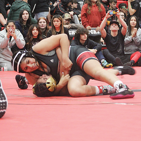 Pershing County’s Magdalena Ramirez wrestles Isabel Martinez of Incline in round one of the championship match at PCHS on Saturday.