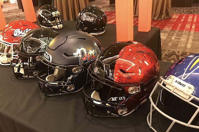Mountain West football helmets are shown at a past conference media event. The conference has agreed to a scheduling arrangement with the ‘Pac-2’ for 2024.