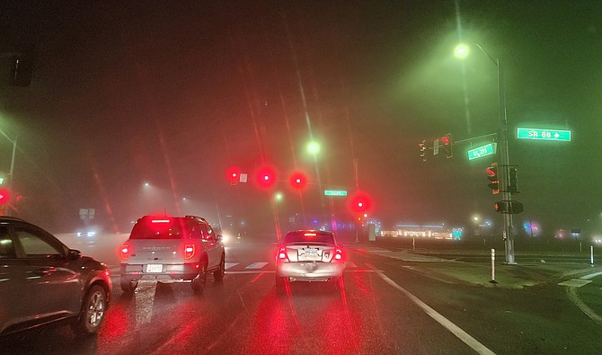 Pam Brekas took this photo of the lights and fog at the junction of highwways 395 and 88 in Minden on Monday night. Brekas and Ronnie Eden have an art show in the Copeland Gallery through Dec. 28.