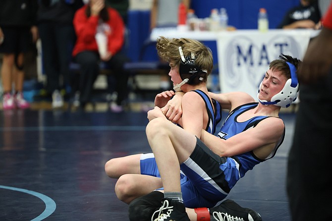 Eatonville's 106-pounders Bryan Boers and Cooper Wood wrestled against each other in the Rogers Holiday tournament. Boers is shown working on mat return while Wood is working on escape.
