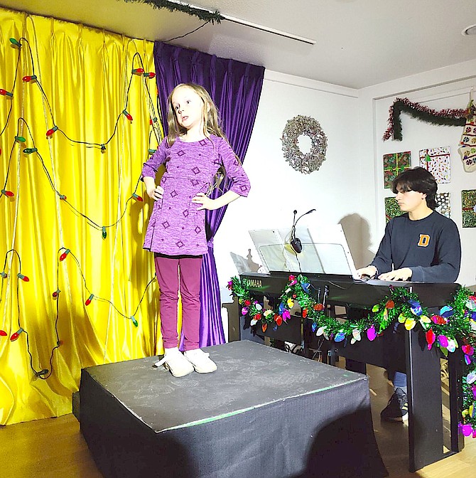 Betsy Jones and Cristian Gonzales rehearse for “Wacky and Wonderful Christmassy Stuff, a Yuletide Cabaret” at the Annex. The play opens Thursday.