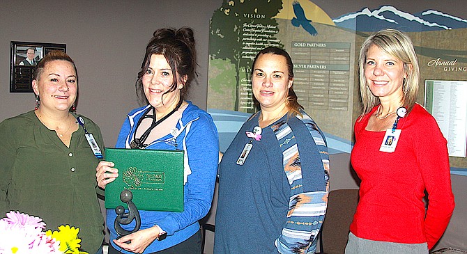 Carson Valley Health Med-Surg ICU Nurse manager Melissa Lynam, ICU Nurse Sarah Key, Med-Surg ICU Nurse Supervisor Stephanie Grant and Chief Nursing Officer Andrea Highfill.  Key is the recipient of the DAISY Award, an appreciation for her dedication and kindness toward patience in her profession.