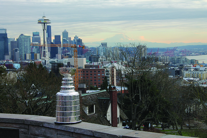The idea for Kevin Ticen’s book, When It Mattered Most, started when he planned a centennial celebration of America’s first Stanley Cup win. The trophy was given a VIP tour of the city. Here it is shown at Queen Anne’s Kerry Park, during the Space Needle’s renovation in 2017.