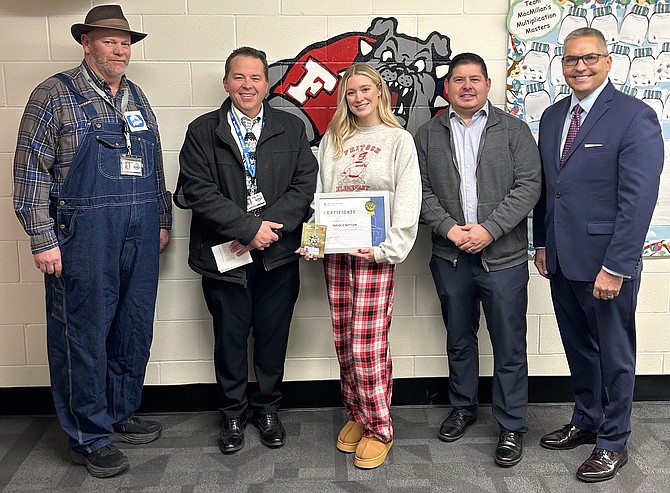Fritsch Elementary School social worker and Safe School Professional Nicole Sitton, center, is recognized by Principal Dan Brown, far left, Carson City School District Superintendent Andrew Feuling and representatives from Greater Nevada Credit Union.