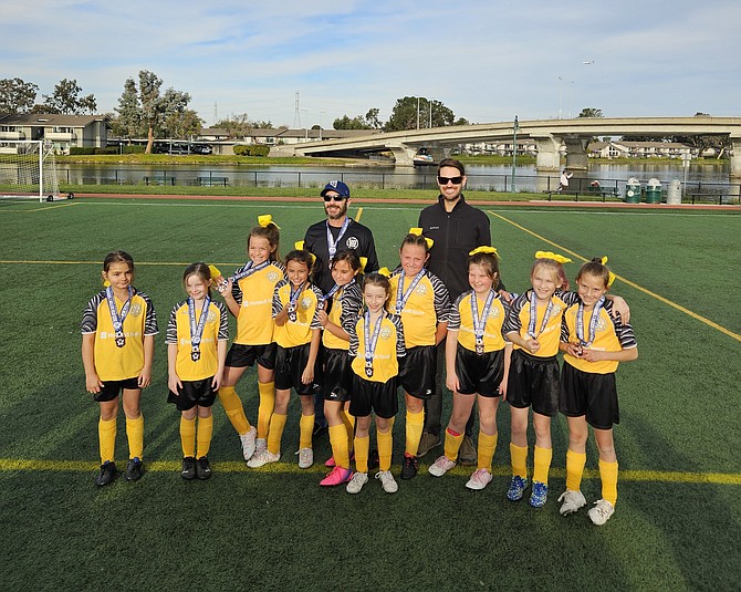The Hornets, a Carson Valley AYSO soccer team, pose with their medals after taking third in the section two tournament in Foster City, California. The Hornets completed their season with a 17-1 record.