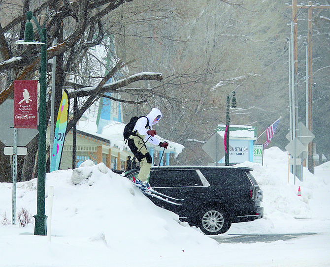 With so much snow the ski resorts were closed, a skier made due with the pile out in front of the Genoa Country Store on Feb. 28, 2023.