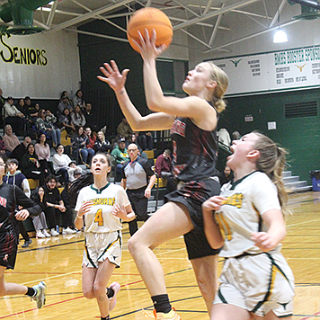 Pershing County’s Taylor Garland goes up for a shot against Pershing County on Dec. 21 in Battle Mountain.