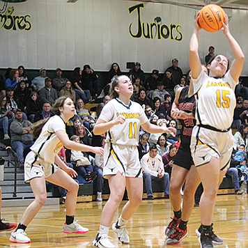 Battle Mountain’s Heidy Amezcua comes down with a rebound during Thursday’s home game against Pershing County.