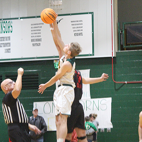 Battle Mountain’s Lewis Strong wins the tip to start Thursday’s home game against Pershing County.