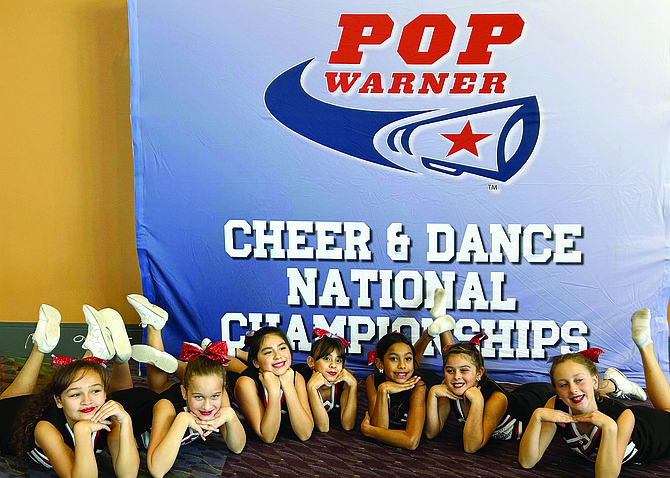 MARCI CARRUTH • Provided to Great Basin Sun
Lovelock’s Pop Warner cheerleaders prepare to perform in the national competition in Orlando, Fla., on Dec. 7. From left to right- Mya Williams-Gonzalez, Raeann Echols, Kaylene Jimenez, Minnie Hernandez, Miley Canchola, Audrina Lopez and Isabelle Anderson.