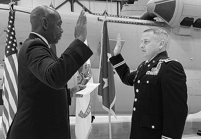 Carson City resident Steve Nielsen, right, reaffirms his oath of a warrant officer to Adjutant General Maj. Gen. Ondra Berry on Dec. 1.